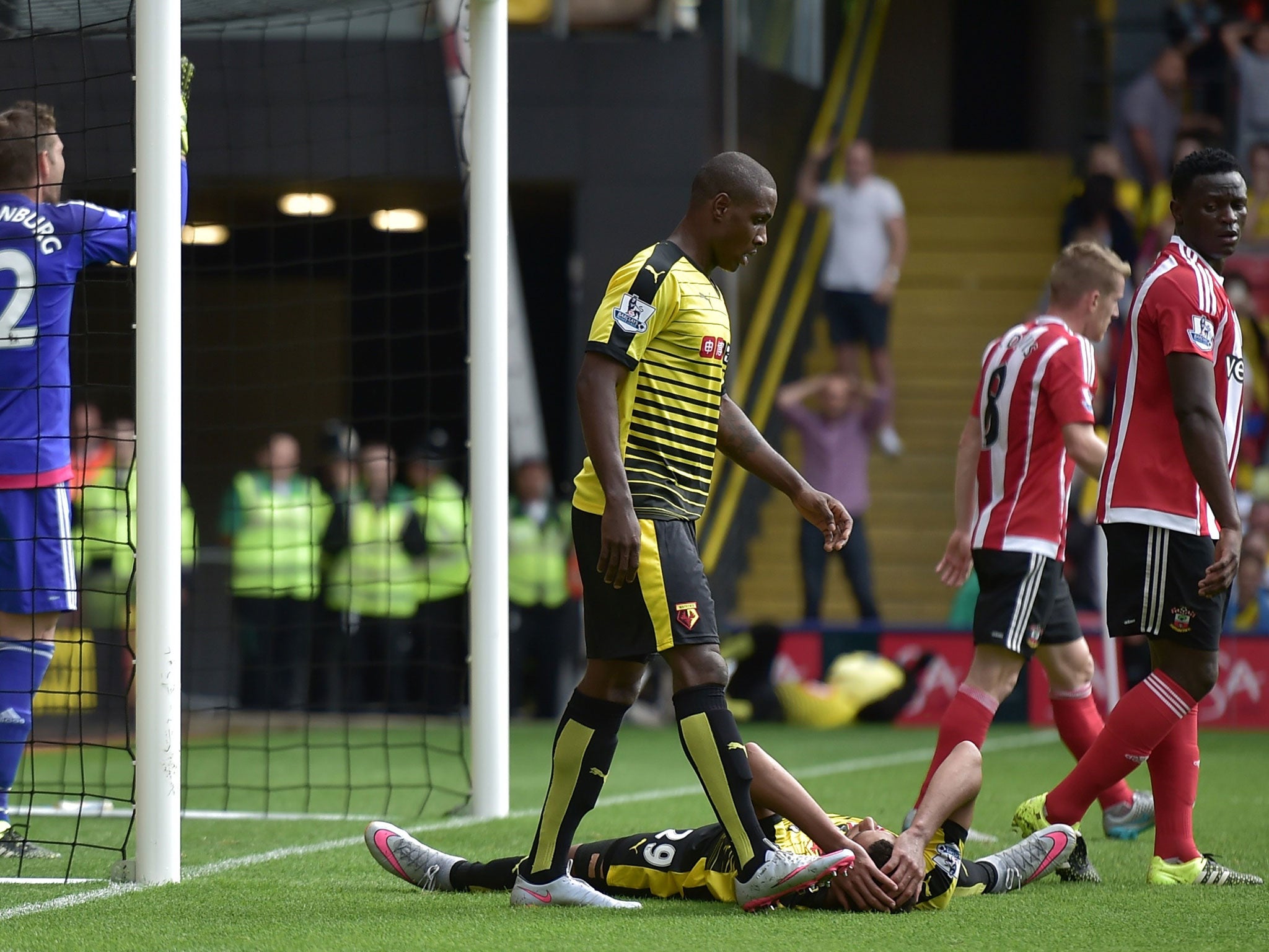 Watford's French midfielder Etienne Capoue (down) reacts after missing an opportunity