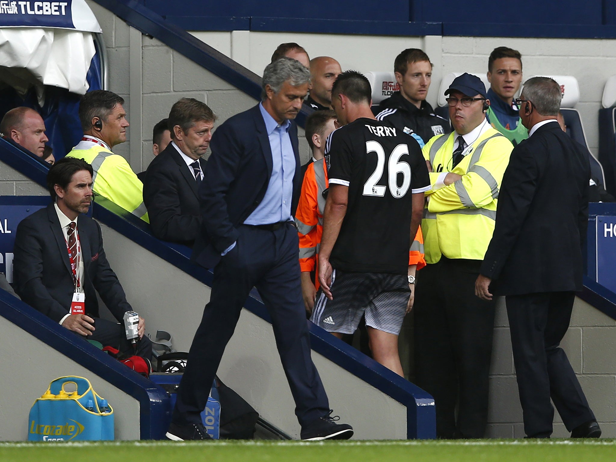 John Terry walks past Jose Mourinho after his red card