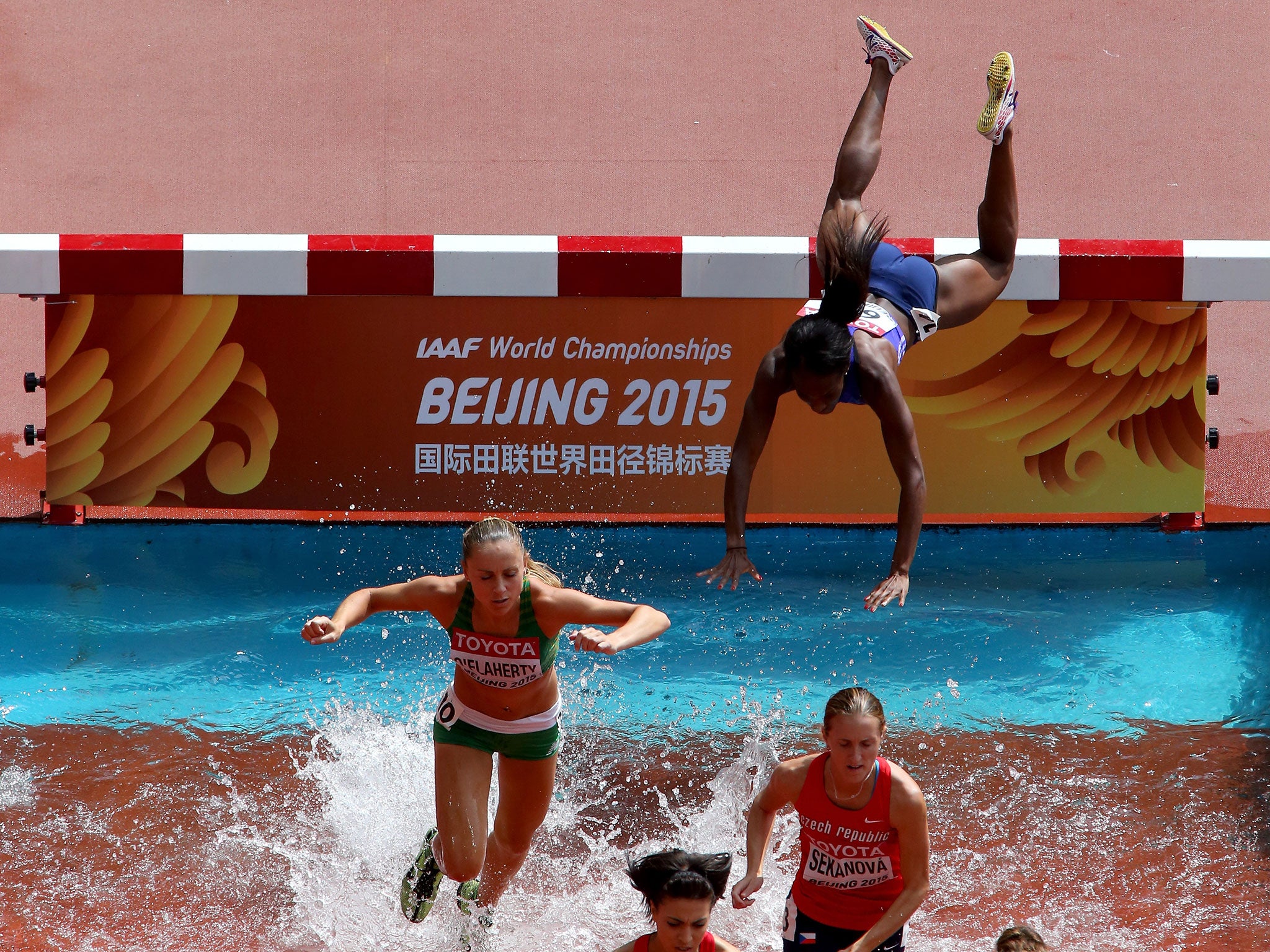 Rolanda Bell tumbles in the water jump