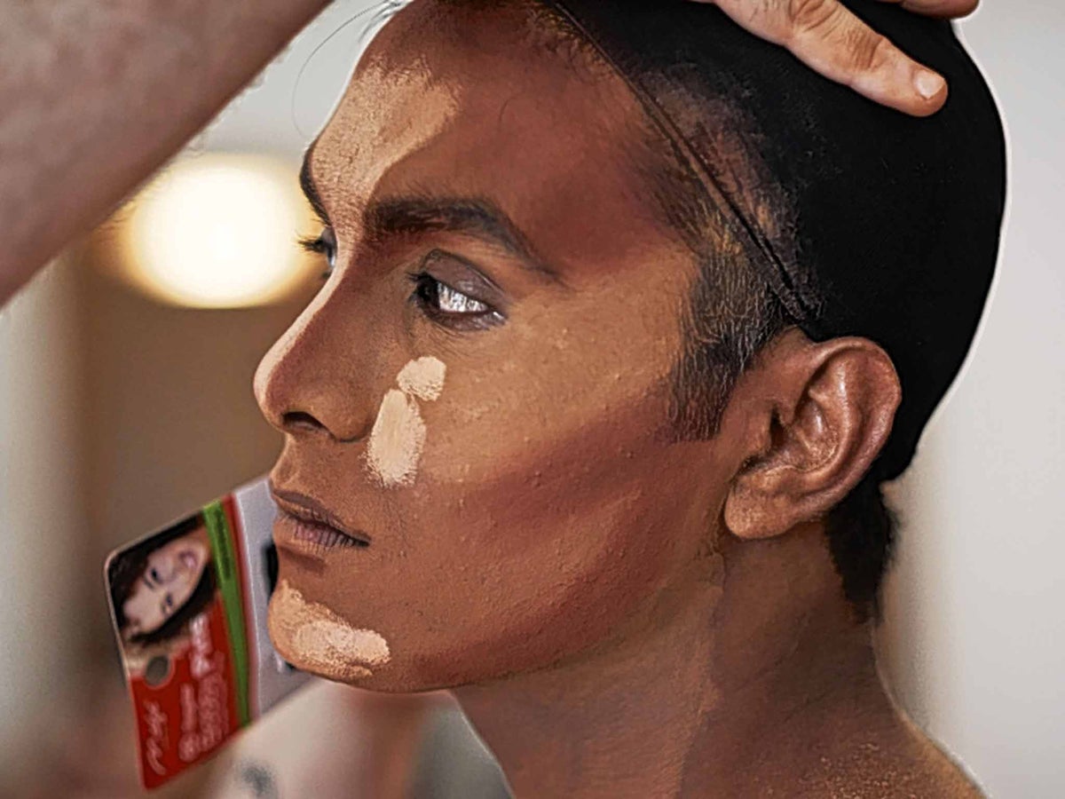 A still from Muslim Drag Queen showing an artist putting on their makeup