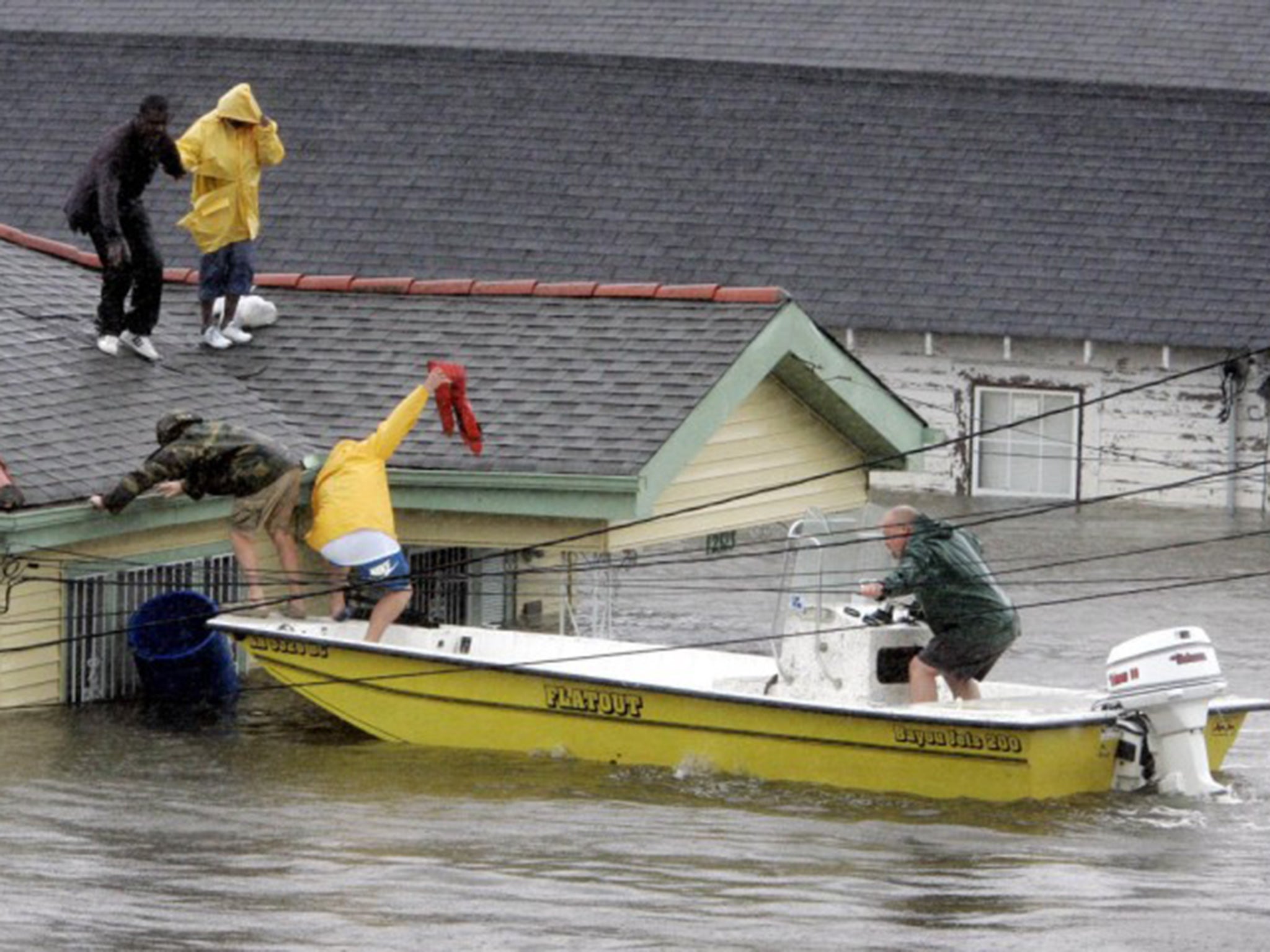 Residents being rescued from their rooftop after Hurricane Katrina hit New Orleans in 2005