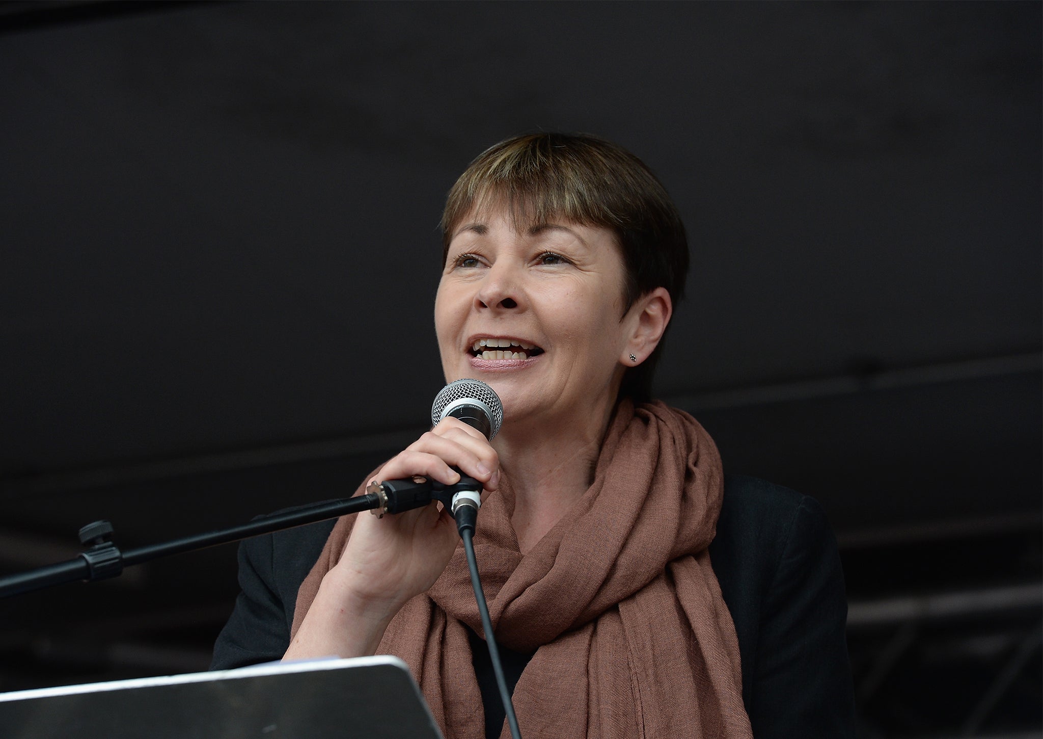 Caroline Lucas speaks to thousands of demonstrators gathered in Parliament Square to protest against austerity and spending cuts on June 20, 2015 in London, England. 