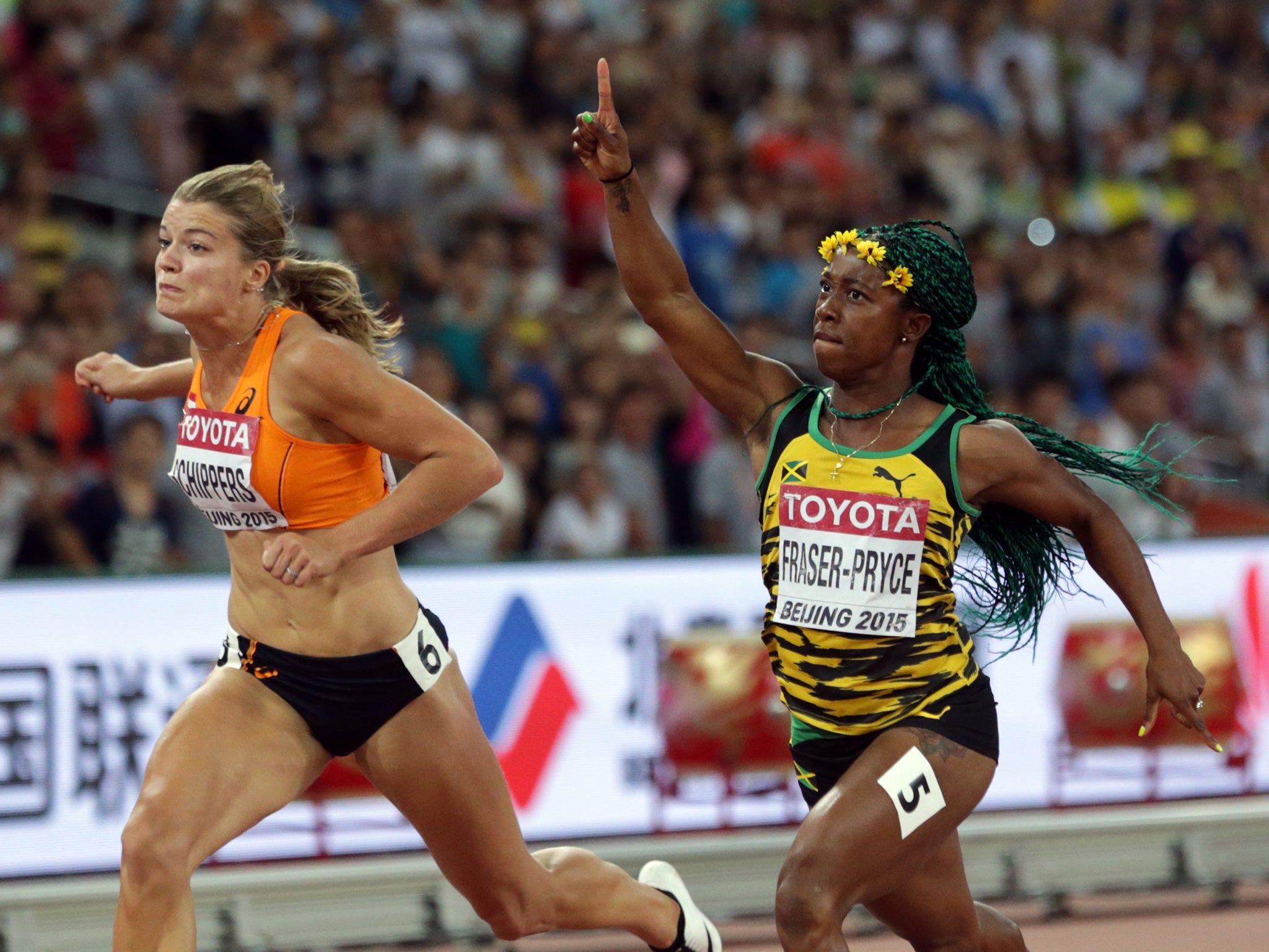 Shelly-Ann Fraser-Pryce (right) wins the 100m ahead of fast finisher Dafne Schippers