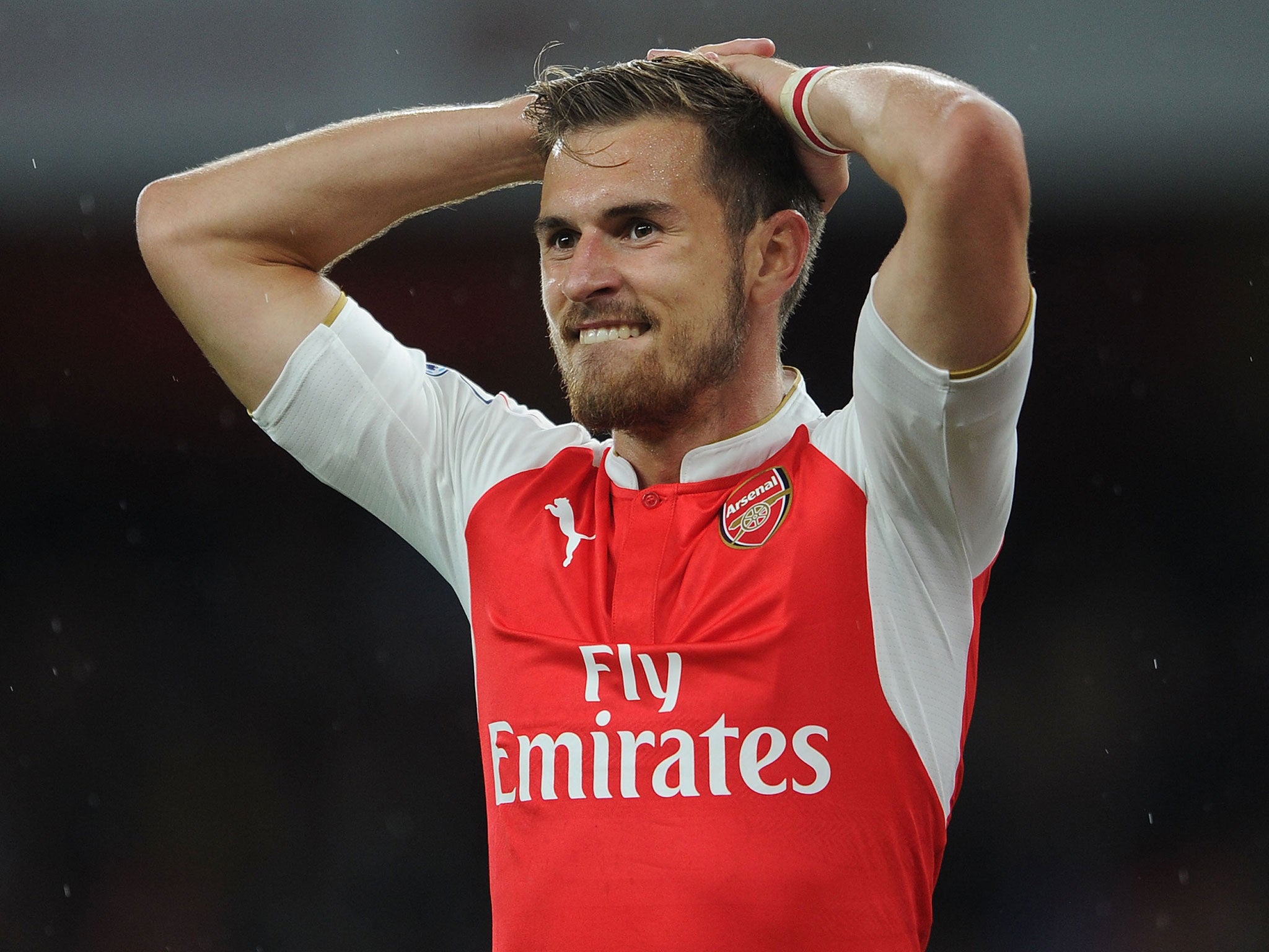 Arsenal midfielder Aaron Ramsey reacts after his goal is ruled out for offside