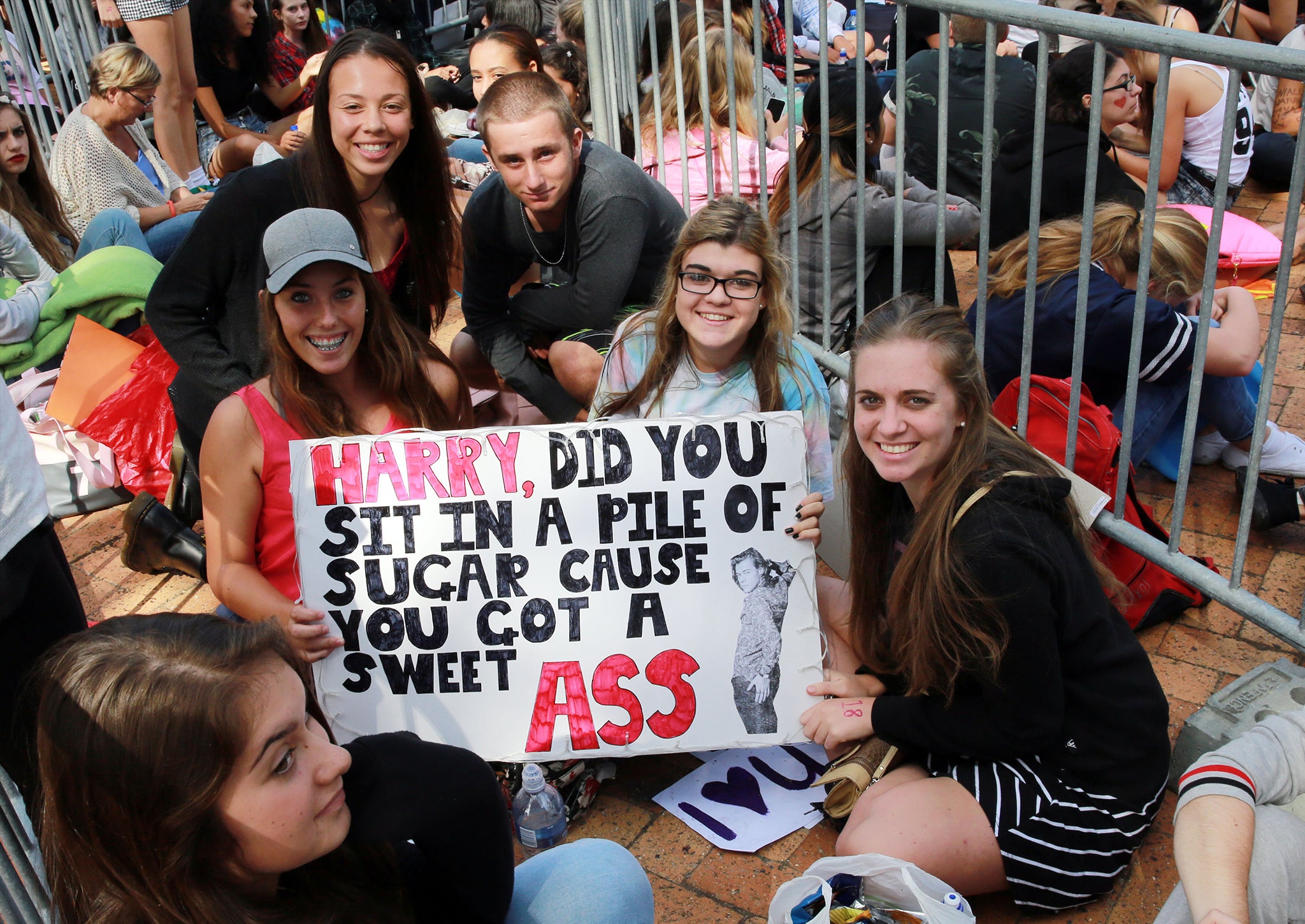 Directioners wait outside a One Direction concert in Cape Town in April 2015