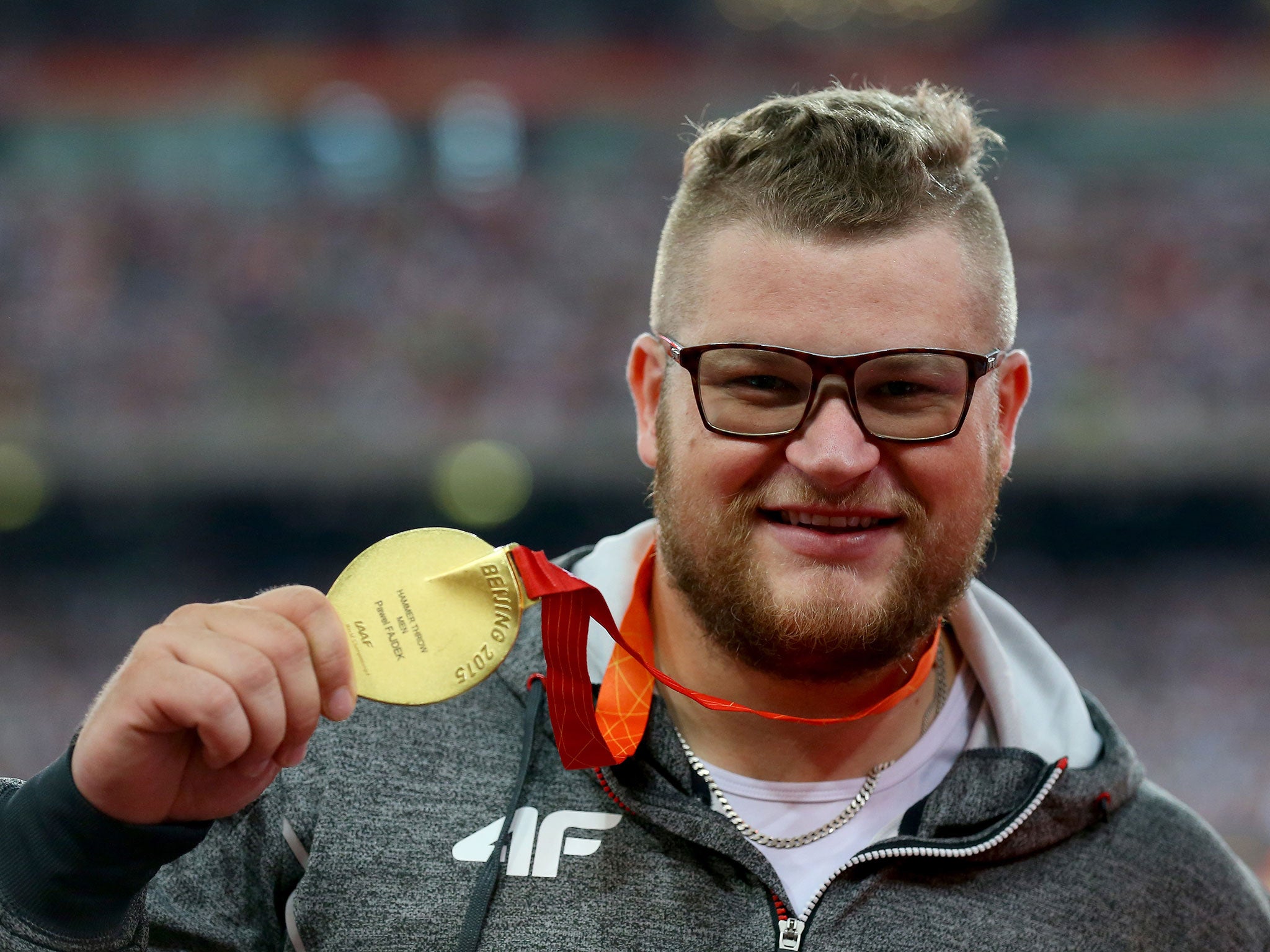 Pawel Fajdek shows off his gold medal in the hammer