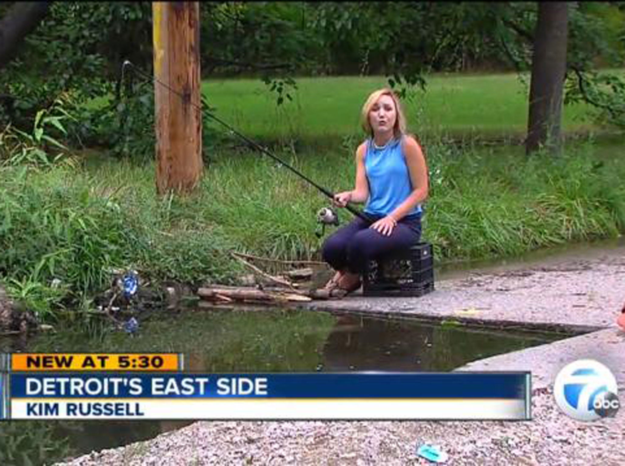 Local are fishing at a sinkhole in Detroit