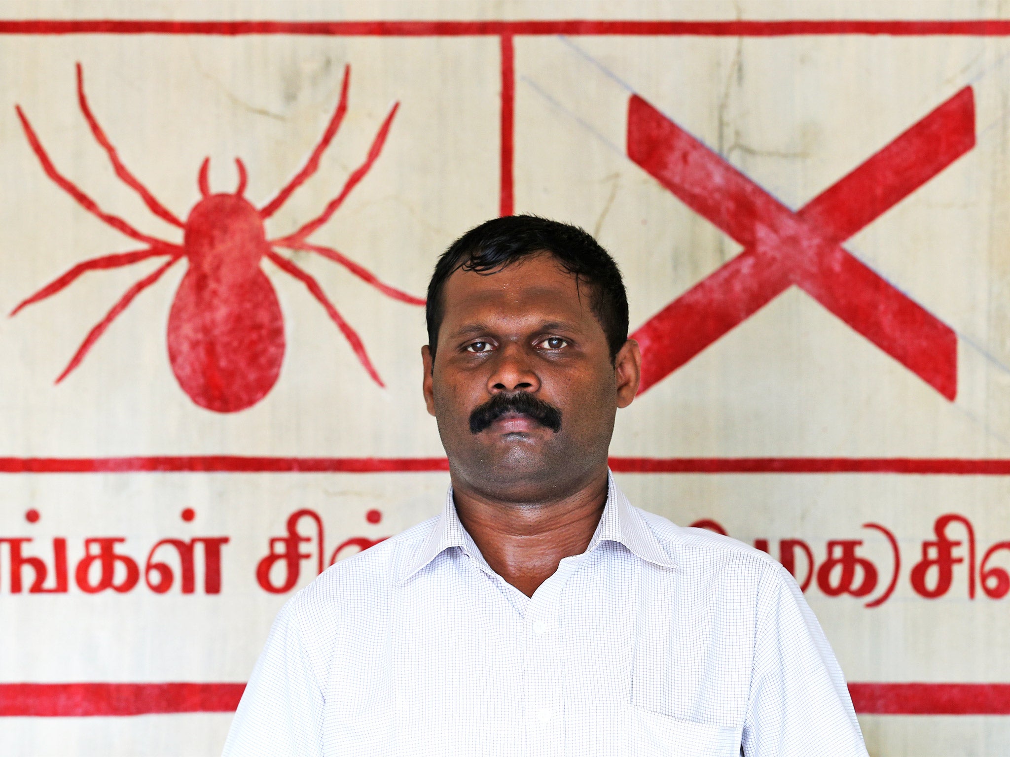 Sivanthan Navidra, aka Venthan, former Tamil Tiger and a Crusaders for Democracy candidate in Sri Lanka’s parliamentary election earlier this month, in front of the party symbol