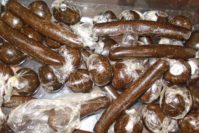 Balls and sticks of 'charas', which is made from the resin of the cannabis plant
