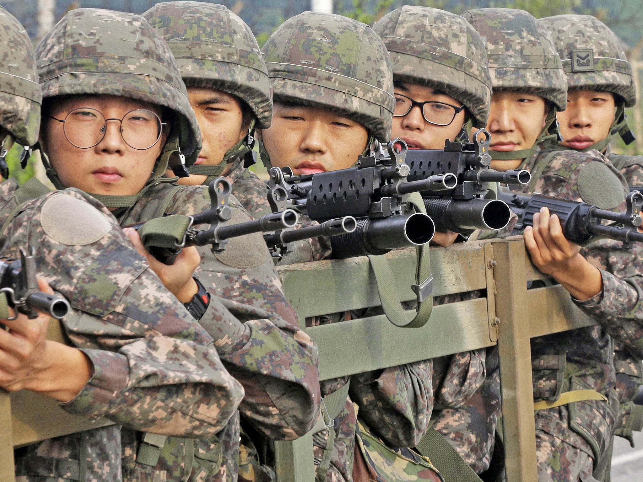 South Korean soldiers retreat from the DMZ after the deal
