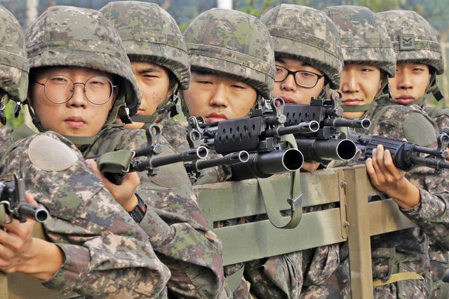 South Korean soldiers retreat from the DMZ after the deal