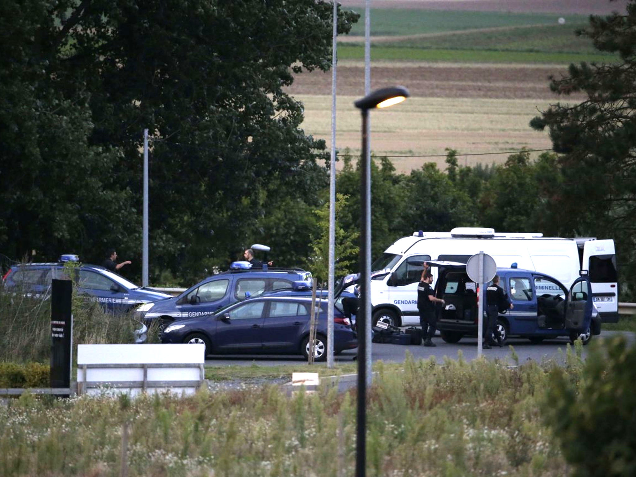 Gendarmes and policemen near the traveller camp in Roye, northern France (Getty)