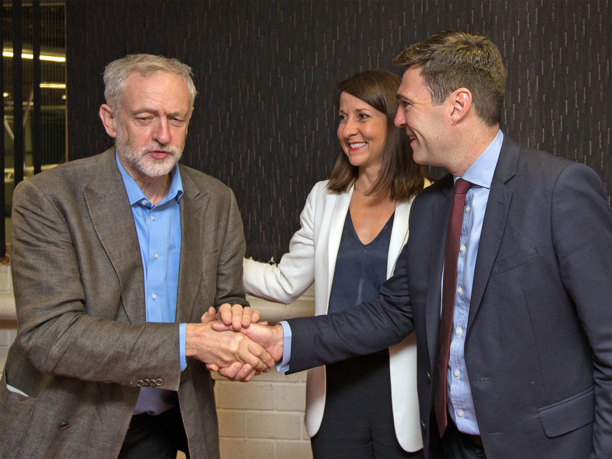 Jeremy Corbyn is greeted by fellow Labour leadership candidates Liz Kendall and Andy Burnham ahead of a radio hustings in Stevenage