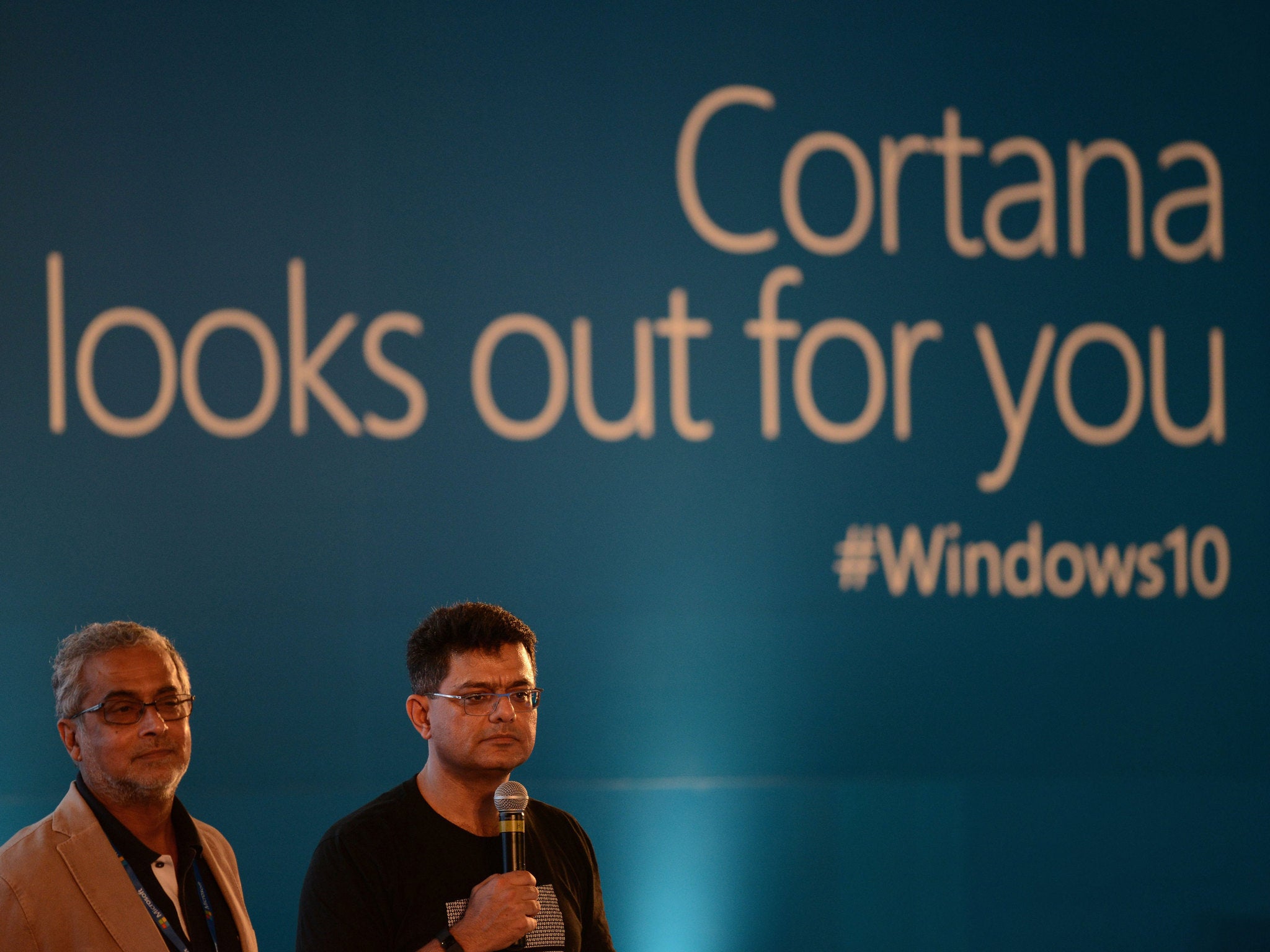 Chairman of Microsoft India Bhaskar Pramanik (L) stands with Director-Windows Business group Vineet Durani during the launch of Microsoft Windows 10 in New Delhi on July 29, 2015