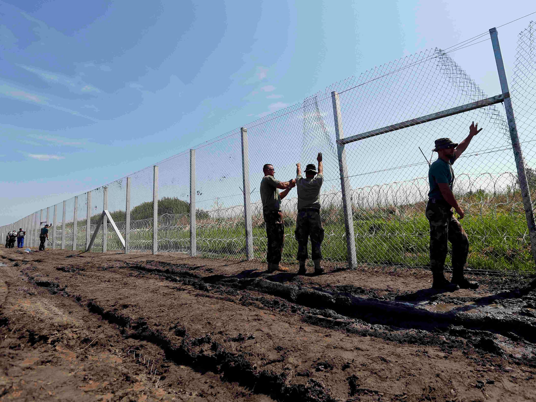 Hungarian soldiers build a fence near the town of Morahalom, Hungary.