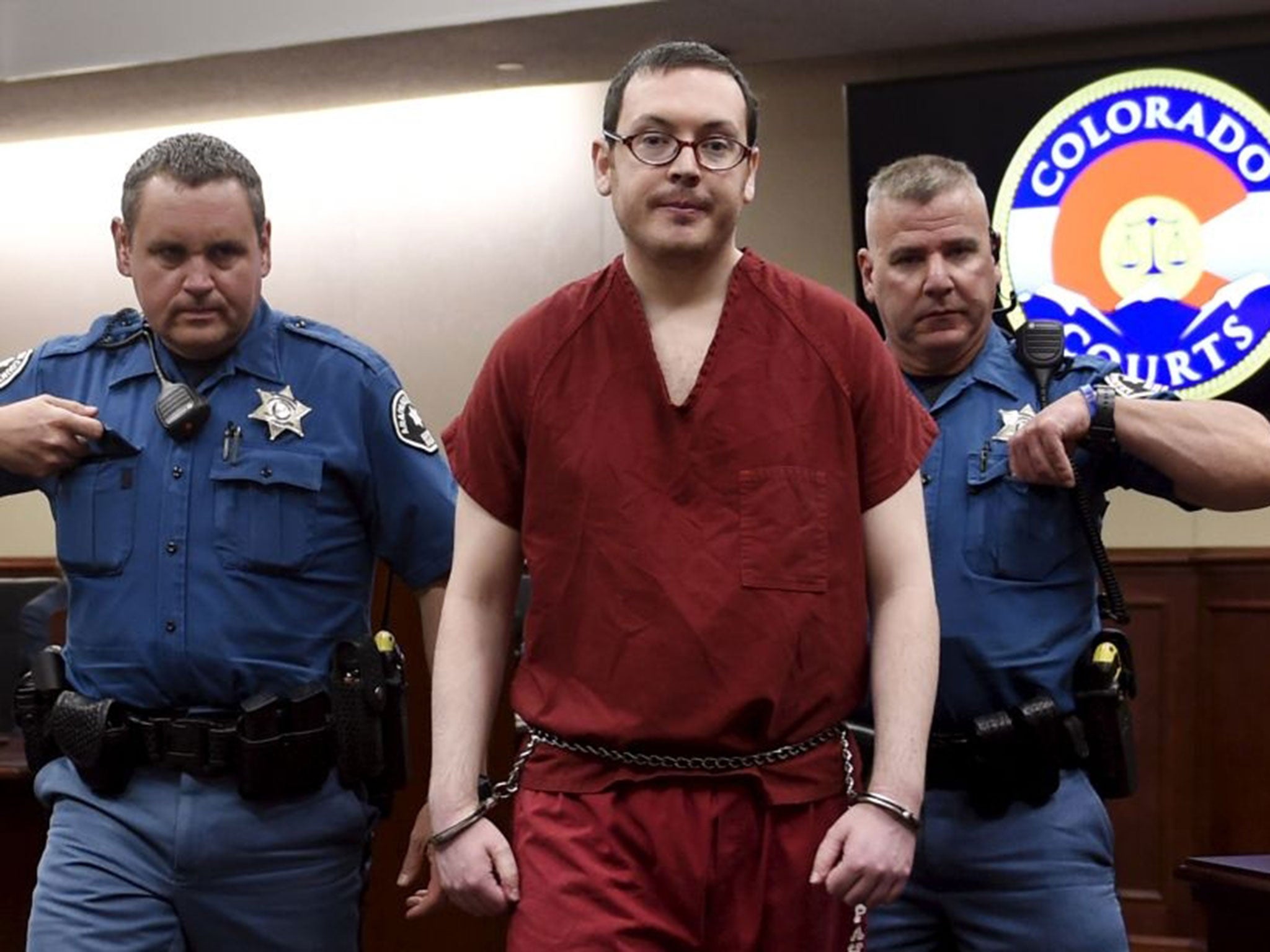 Colorado movie massacre gunman James Holmes (C) leaves court for the last time before beginning his life sentence with no chance of parole after a hearing in Centennial, Colorado August 26, 2015. The judge in the Colorado movie massacre trial will condemn