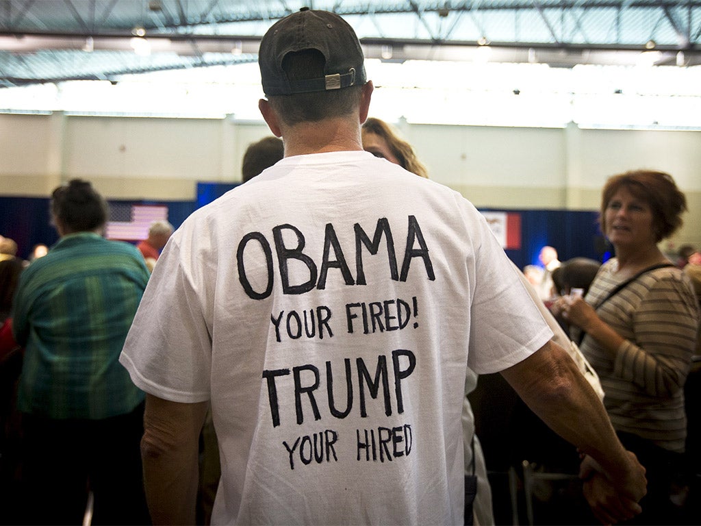 A supporter of Donald Trump makes his feelings known at the Republican presidential candidate’s ‘Make America Great Again’ rally in Dubuque, Iowa, on Tuesday night