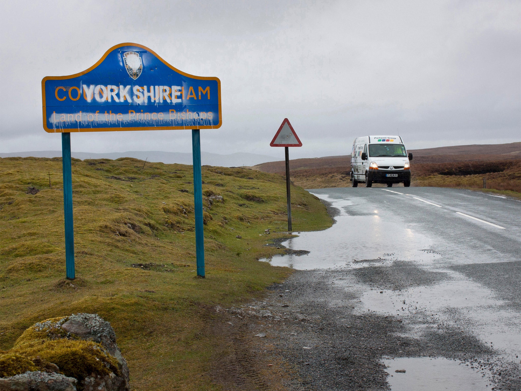 County boundary changes in 1974 brought part of the North Riding of Yorkshire into County Durham. Here, on the B6276, the sign has been painted over with the white rose of Yorkshire and county name