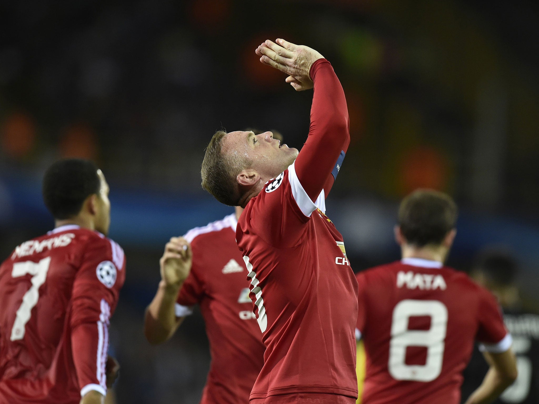 Wayne Rooney celebrates his goal against Club Brugge