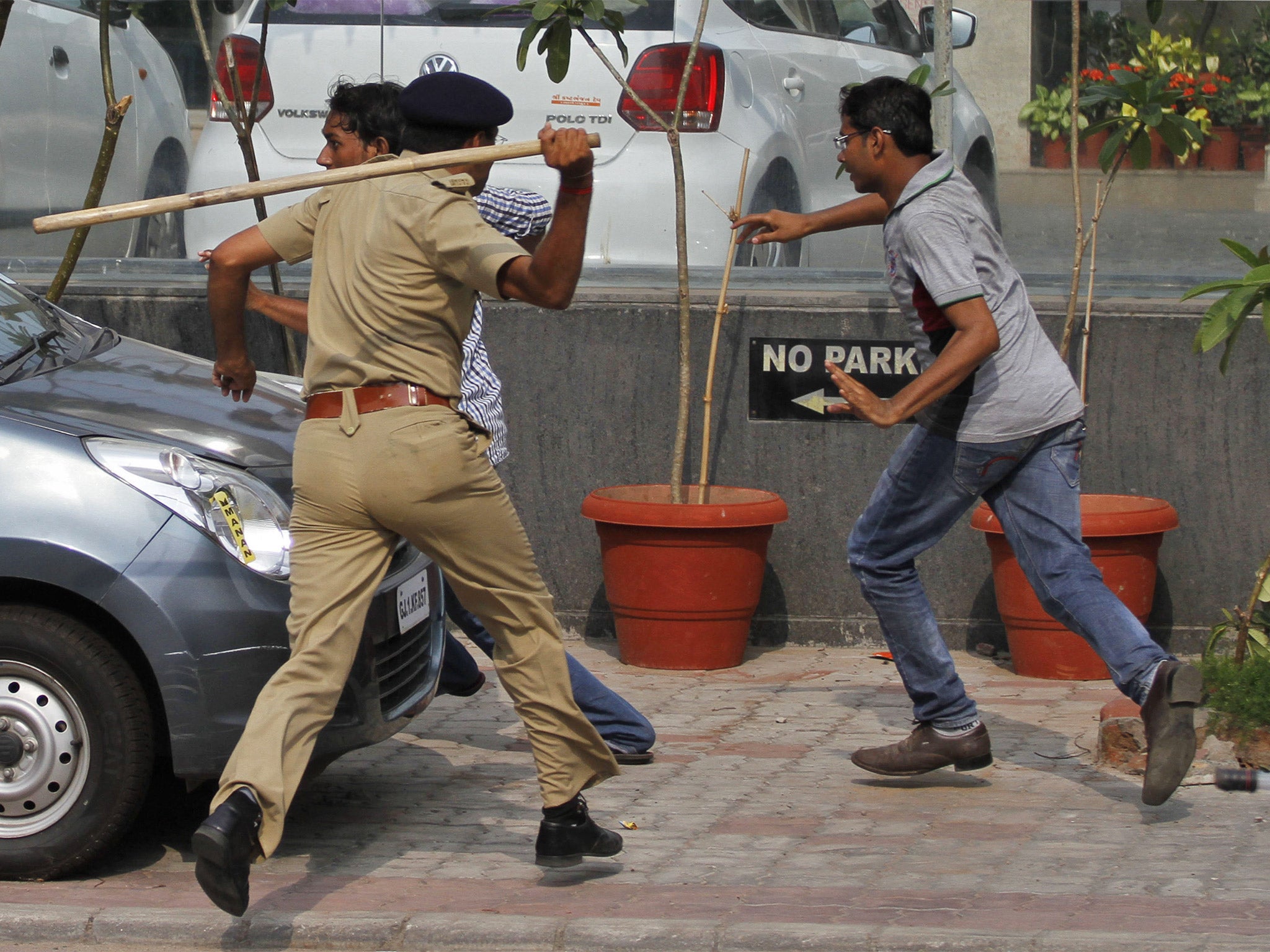 Indian police with batons disperse Patel caste protesters in Ahmadabad