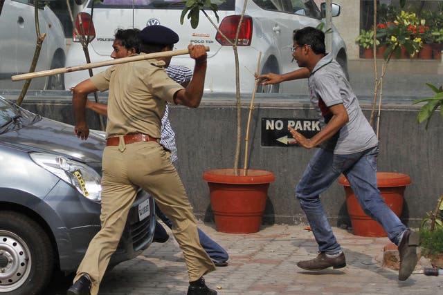 Indian police with batons disperse Patel caste protesters in Ahmadabad 
