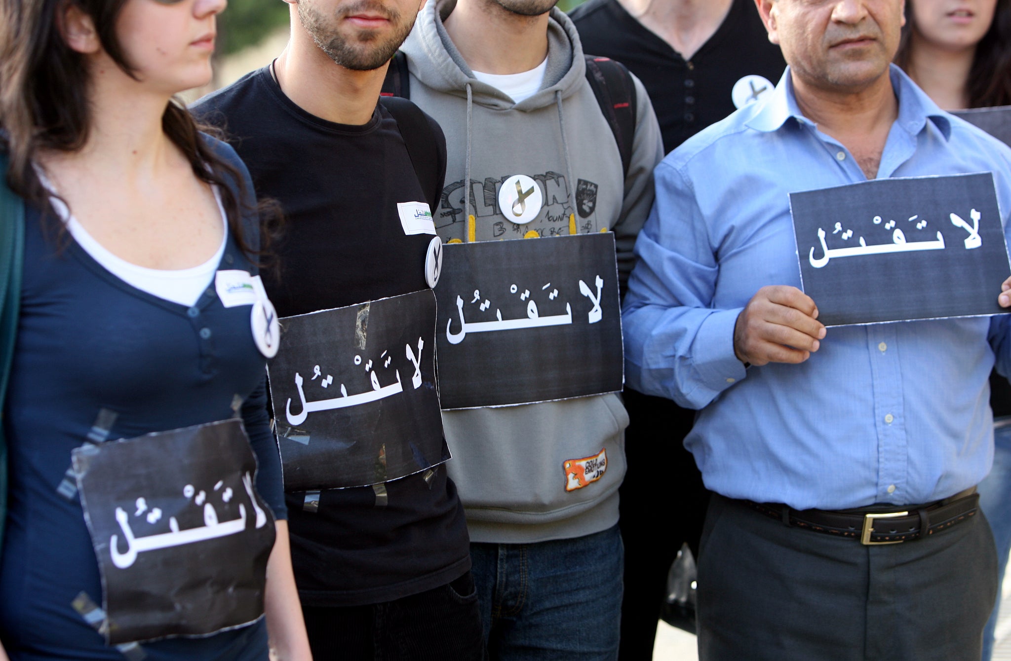 Lebanese human rights activists protest outside the Saudi embassy in Beirut, over the planned execution of a former Lebanese TV presenter accused of 'sorcery'