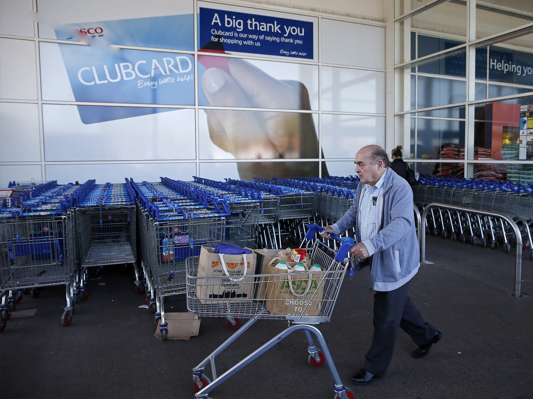 A man shops at a Tesco supermarket in Sunbury-on-Thames in Surrey