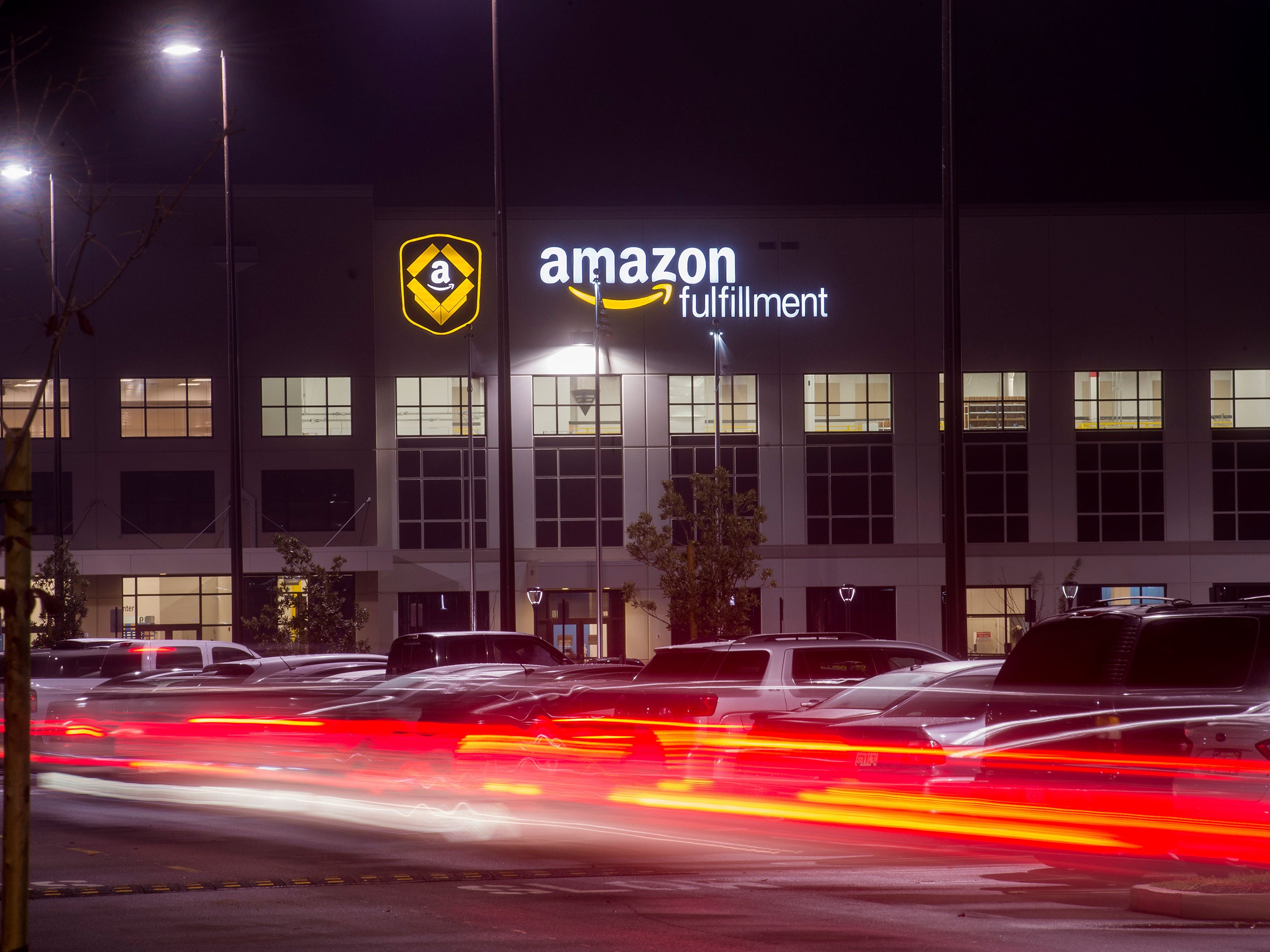 Employees arrive for work at an Amazon Fulfillment Center, ahead of the Christmas rush, in Tracy, California, November 30, 2014