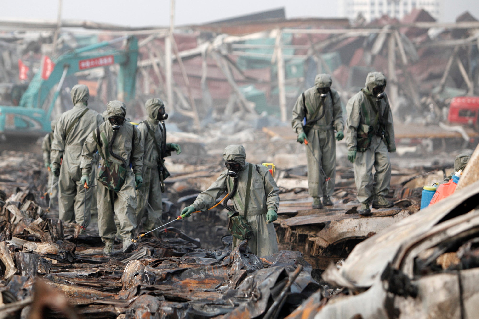 Rescuers search the wreckage the site of the explosion