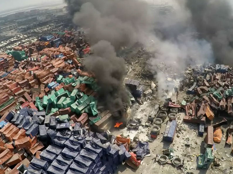Thousands of shipping containers lie crumpled like paper in the aftermath of the blast