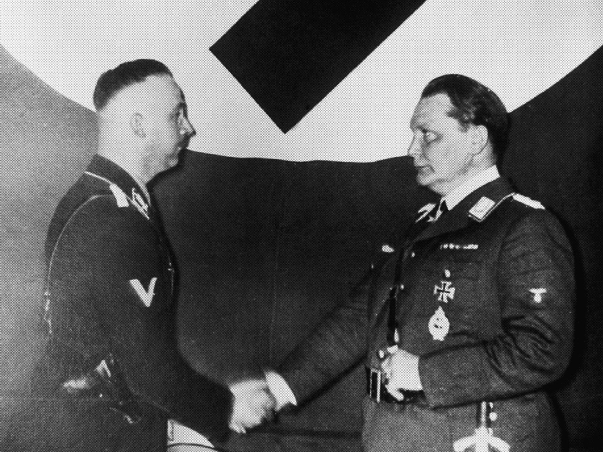 Monster shake: Hermann Göring, right, founder of the Gestapo, hands over control to Heinrich Himmler in 1934