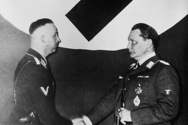 Monster shake: Hermann Göring, right, founder of the Gestapo, hands over control to Heinrich Himmler in 1934