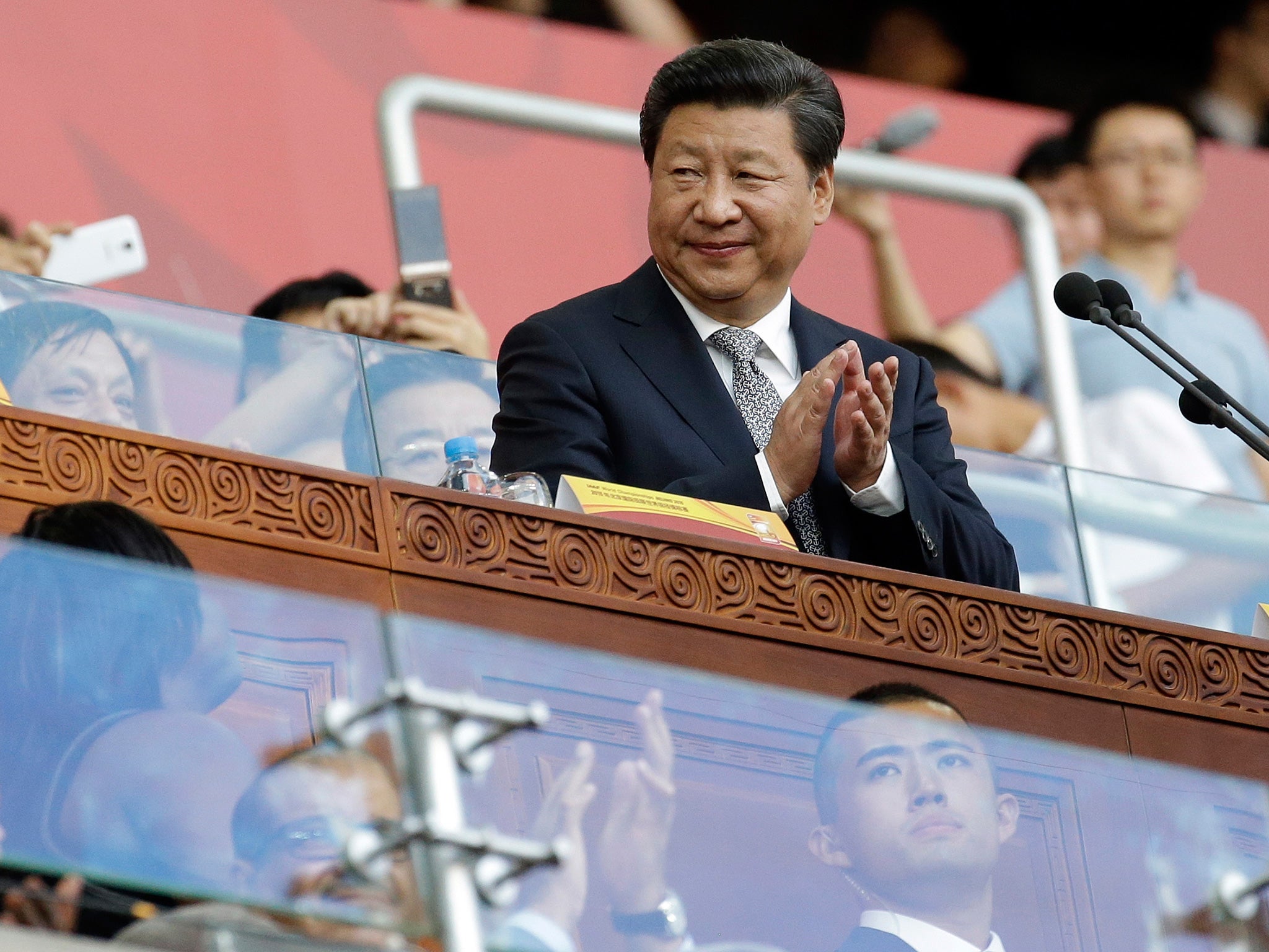 Chinese President Xi Jinping attends the opening ceremony of the World Athletics Championships at the Bird's Nest stadium in Beijing