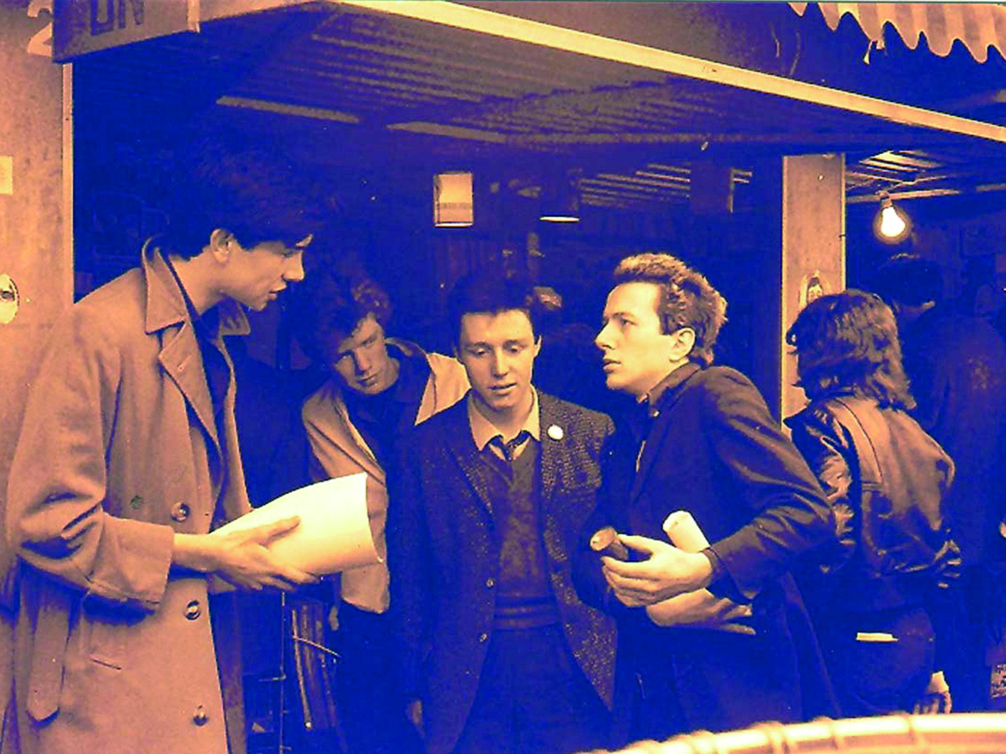 The Rock On stall at Soho market with Joe Strummer, Adrian Thrills and members of the Pop Group, early 1979