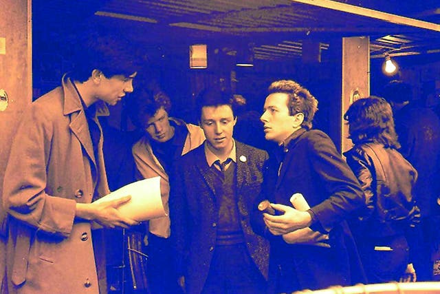 The Rock On stall at Soho market with Joe Strummer, Adrian Thrills and members of the Pop Group, early 1979