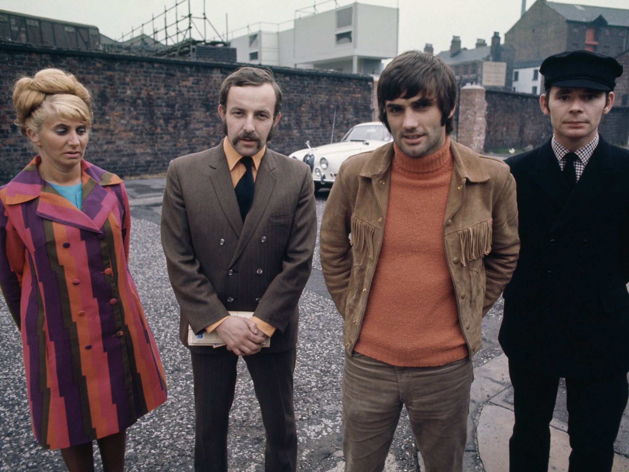 George Best with his staff in Manchester, circa 1968 (Getty)