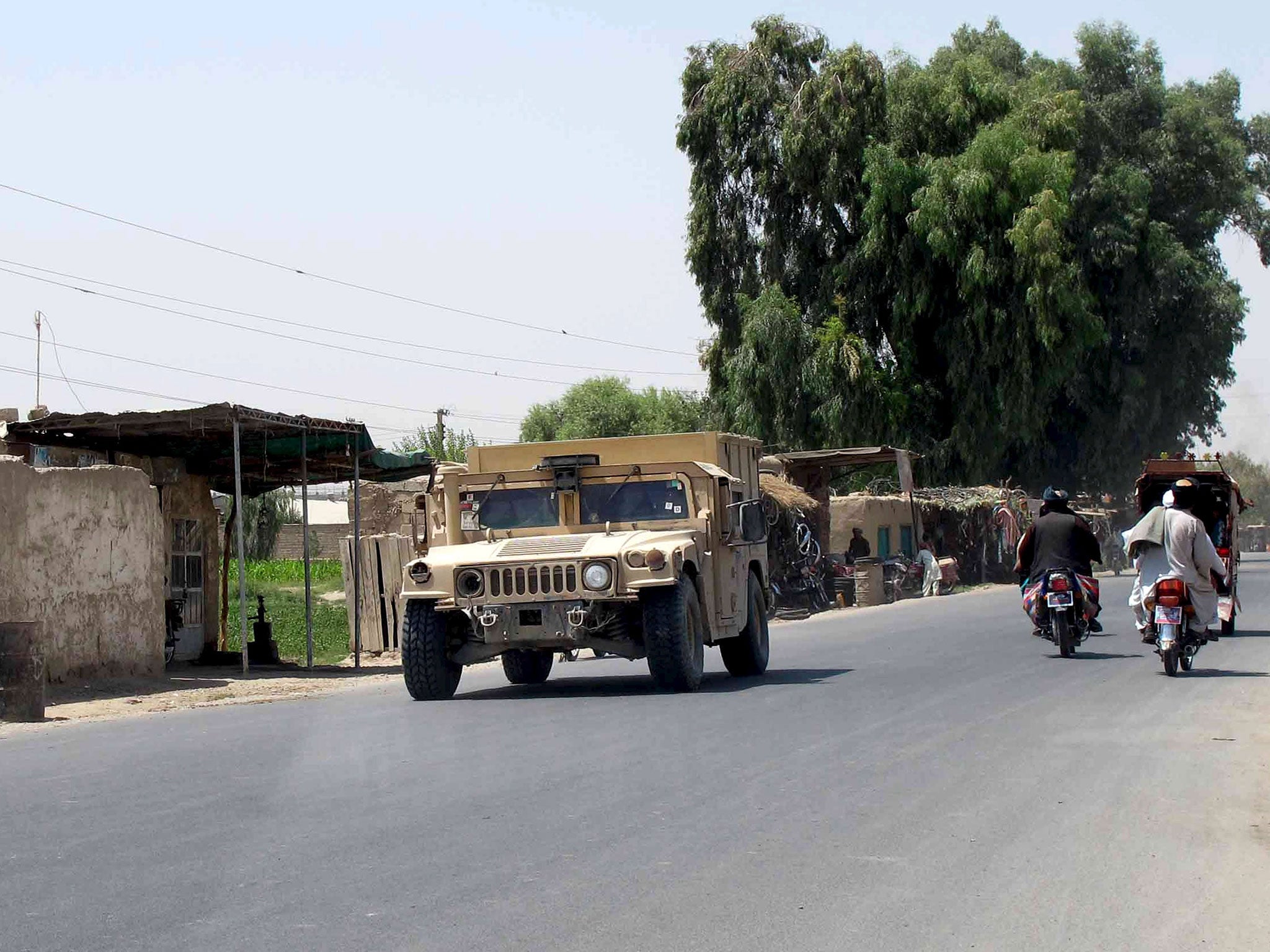 An Afghan National Police armored vehicle patrols on a street in Lashkar Gah capital of Helmand province, Afghanistan August 26, 2015