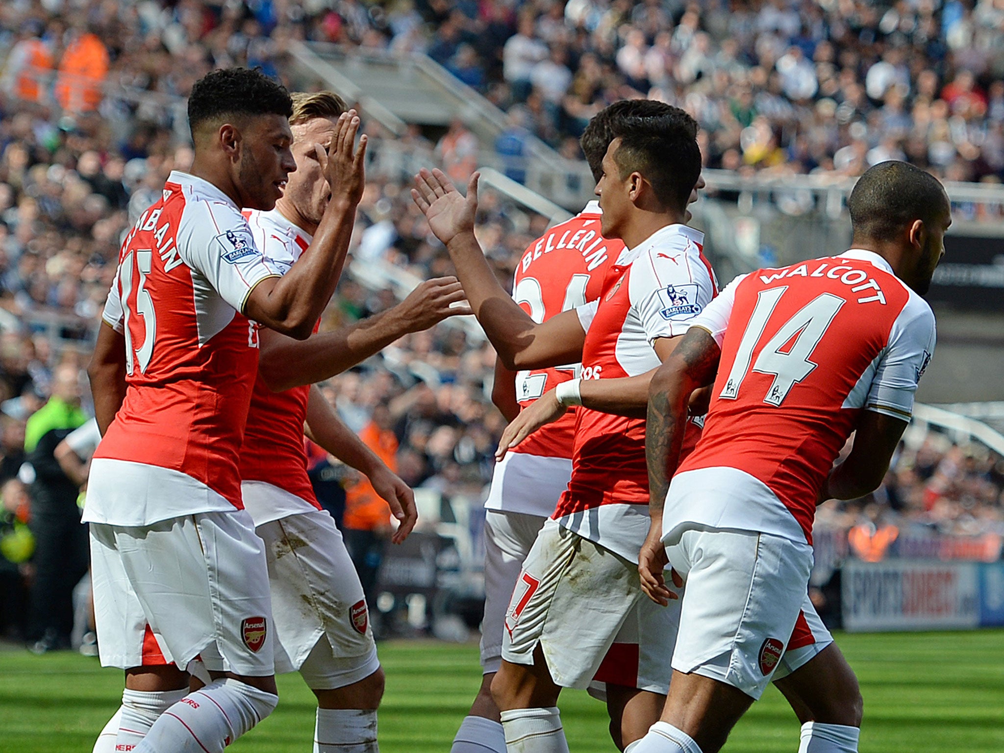 Arsenal celebrate after Fabricio Coloccini's own goal in the 1-0 win over Newcastle