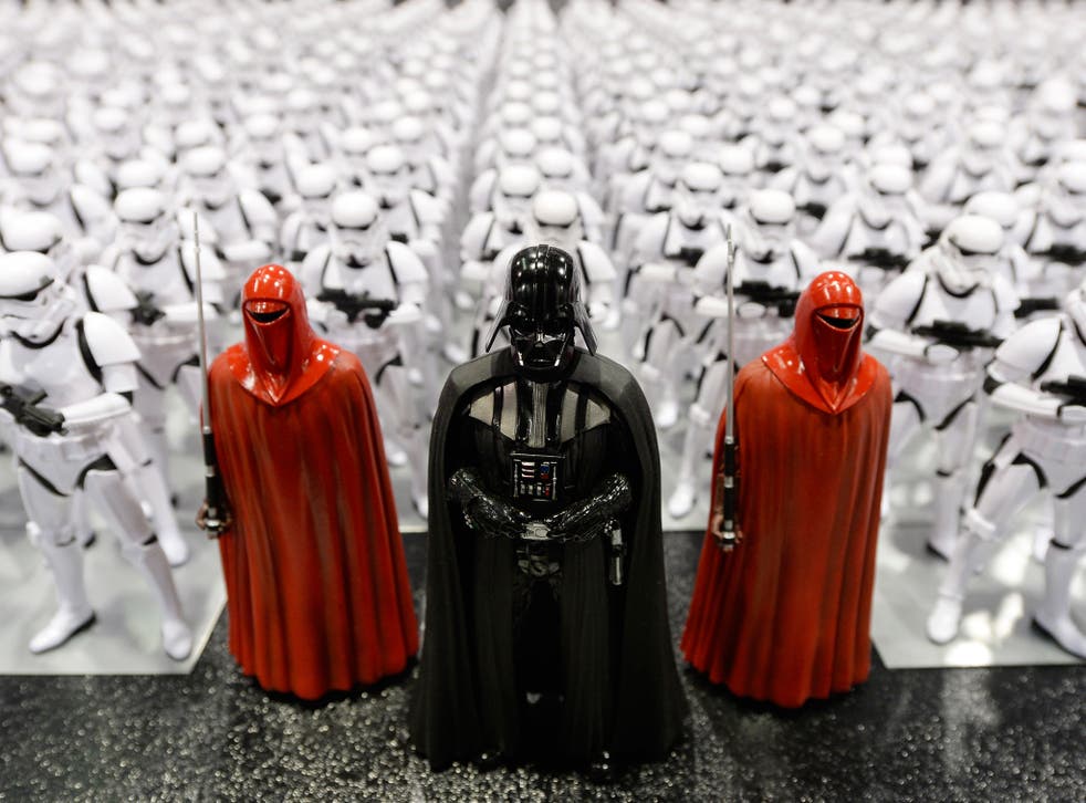 Darth Vader (C) and Stormtrooper figurines are displayed during the kick-off event of Disney's Star Wars Celebration 2015 (Getty)