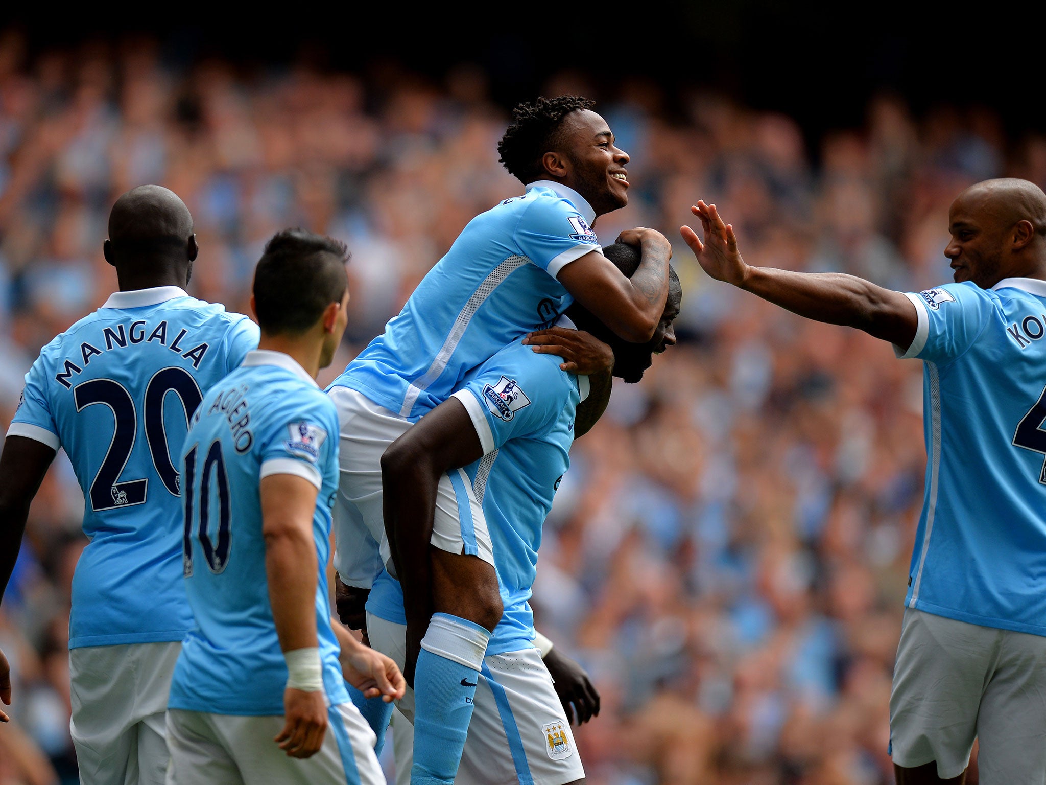 Raheem Sterling celebrates with his Manchester City team-mates