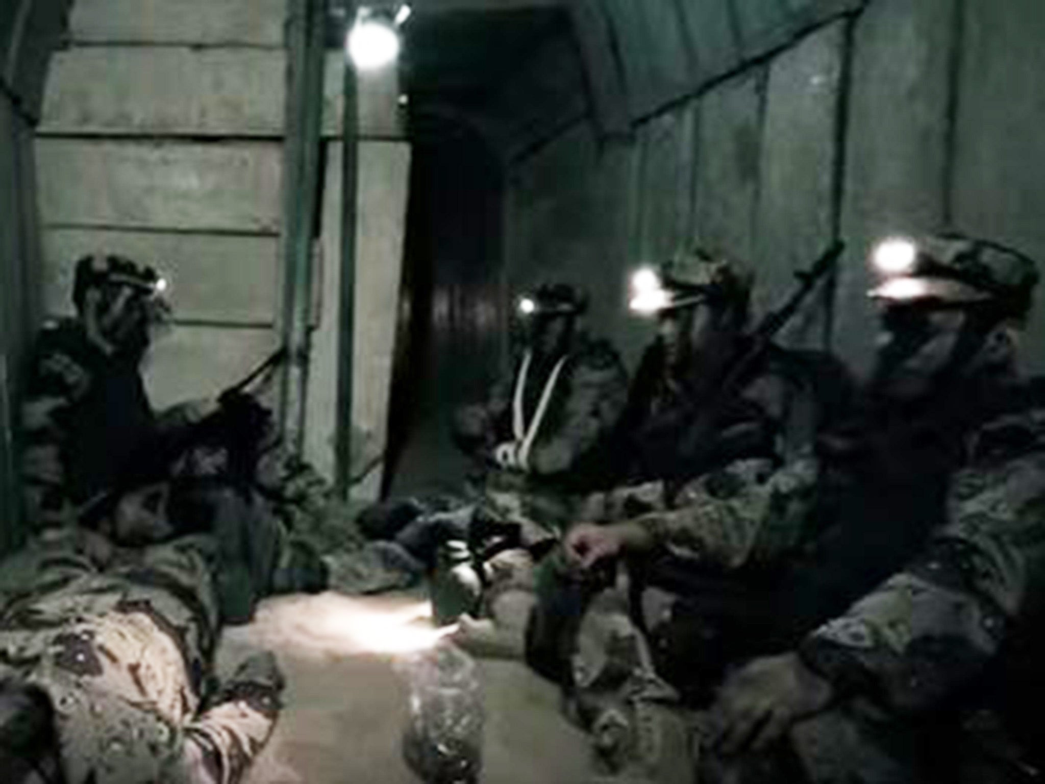 Hamas fighters pictured in the reported tunnel