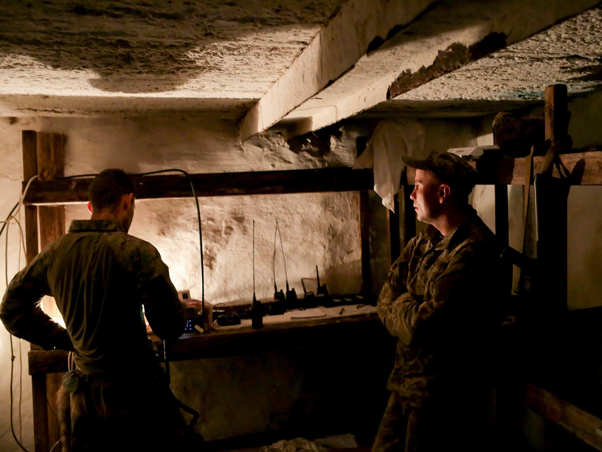 Ukrainian servicemen check the reception equipment at their touch base in Zaytseve village, near Gorlovka in the Donetsk area