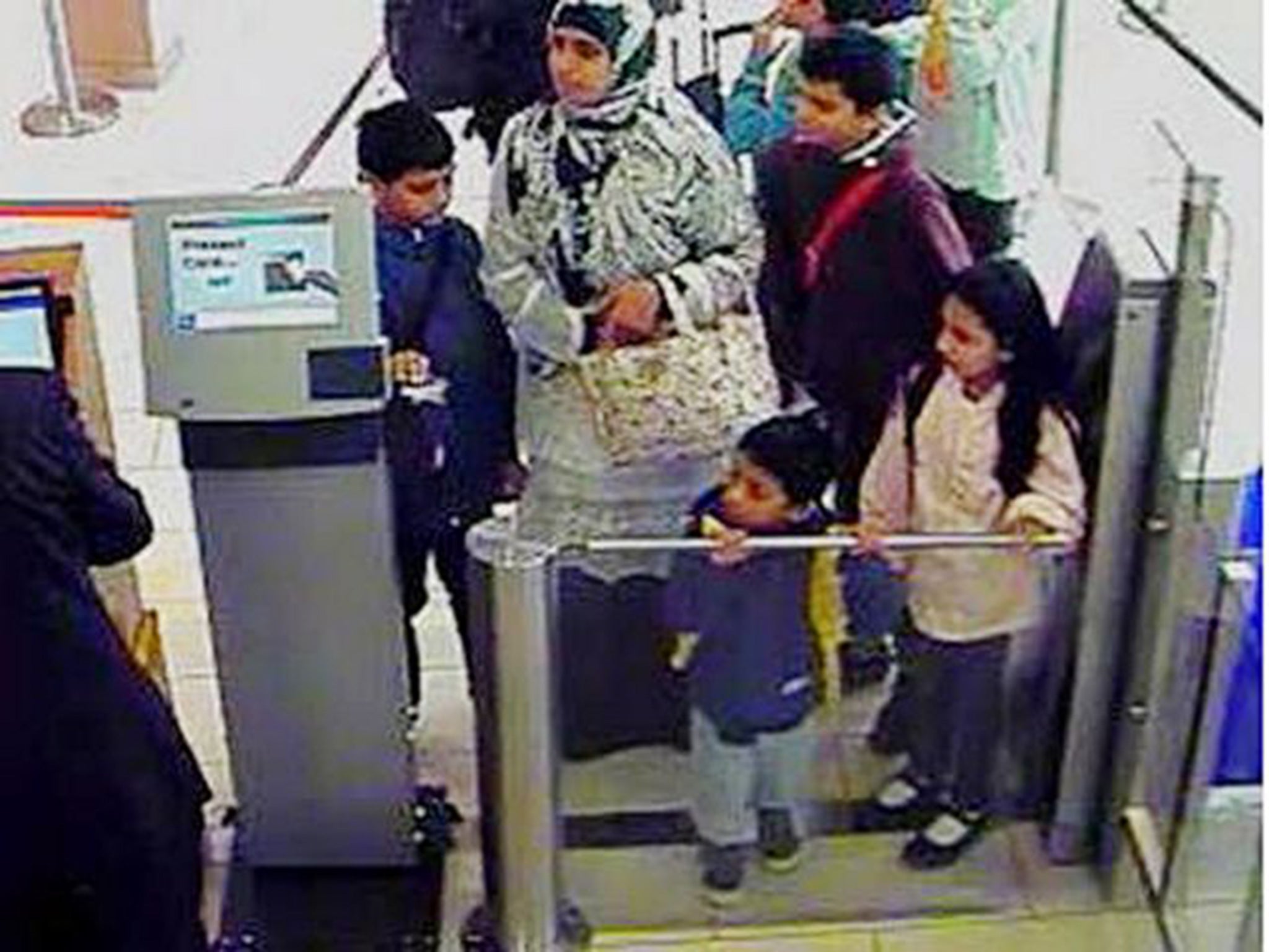 CCTV shows Zahera Tariq, 33, with her children at London City Airport last week