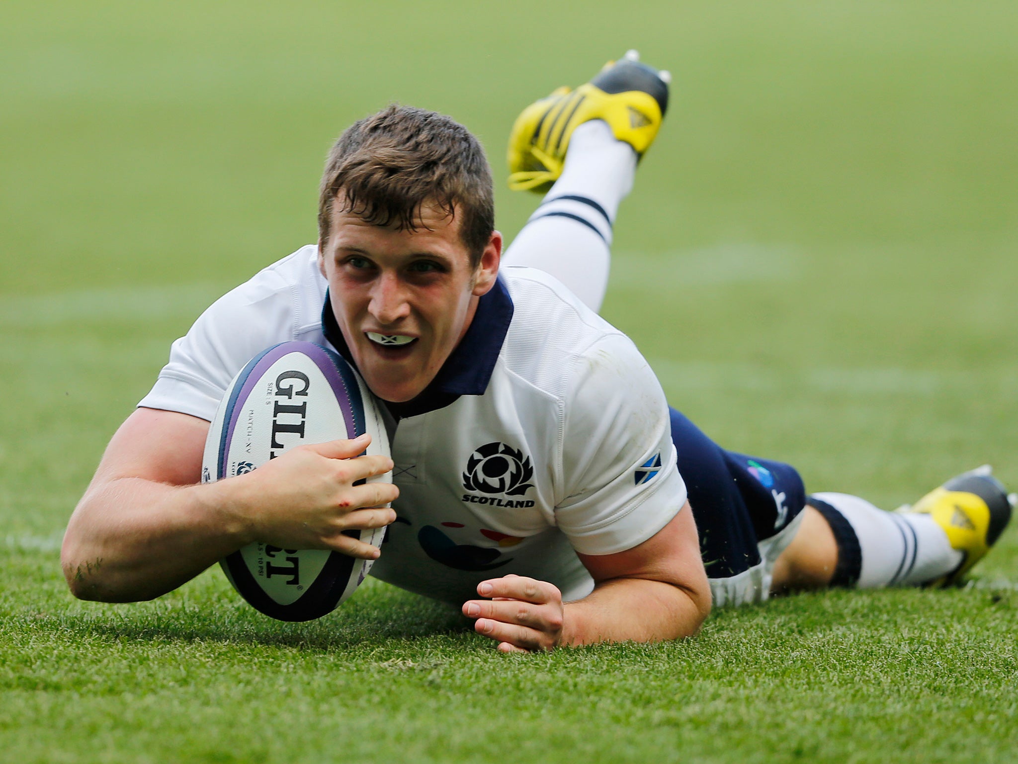 Crossing the line: Mark Bennett scores a try for Scotland against Italy at Murrayfield