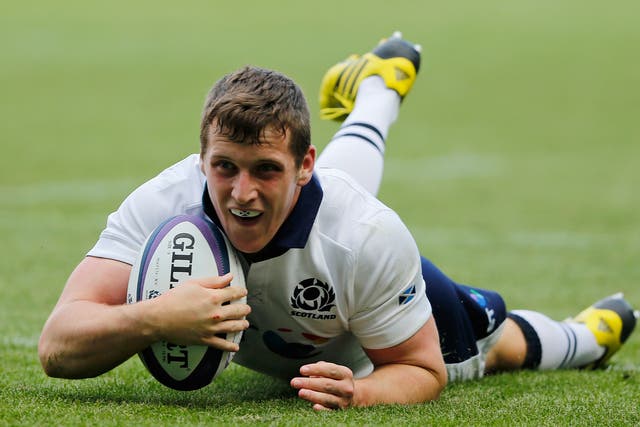 Crossing the line: Mark Bennett scores a try for Scotland against Italy at Murrayfield