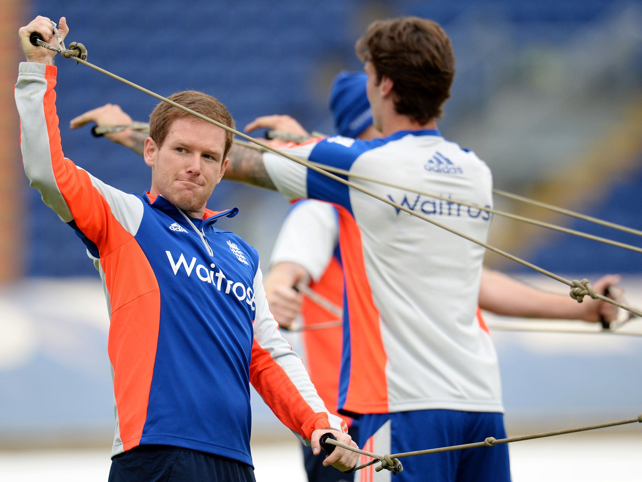 Eoin Morgan stretches during a nets session at Sophia Gardens