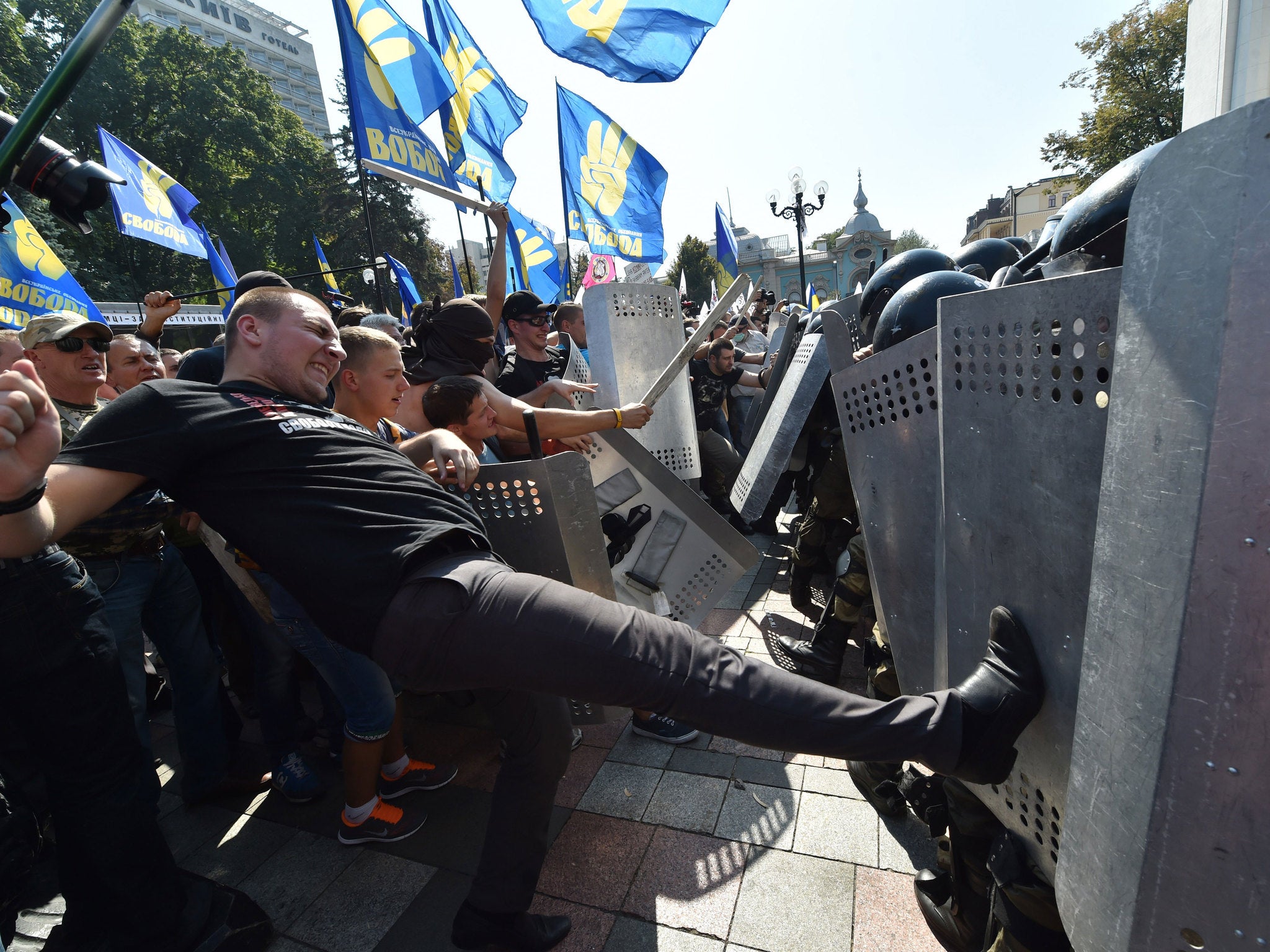Protesters have clashed with police in front of Parliament in Kiev