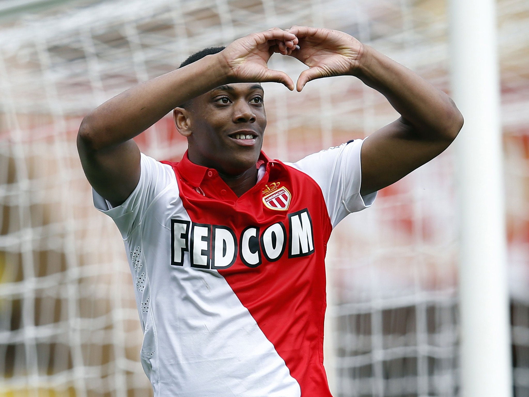 Monaco's French forward Anthony Martial celebrates after scoring a penalty
