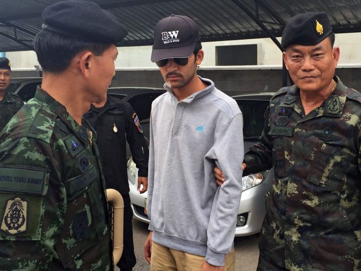 Soldiers from the Royal Thai Army displayed the suspect to journalists near the border with Cambodia