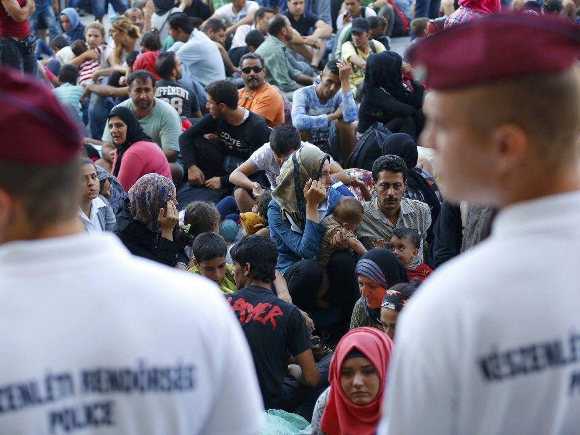 Police forced migrants outside the station after departures were stopped